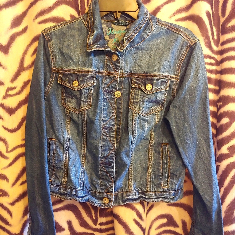 A blue jean jacket cropped